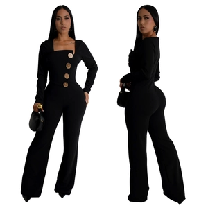 Detail view of black square neck jumpsuit featuring four decorative gold embossed buttons