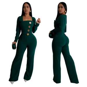 Detail of dark green square-neck jumpsuit featuring large gold buttons and wide-leg design