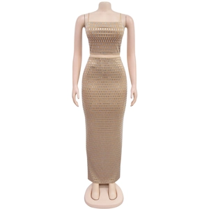 Close-up of sparkling rhinestone mesh detailing on a sleeveless crop top and maxi skirt set