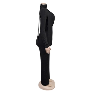 Detail of black rhinestone embellishments on long sleeve slim fit v-neck jumpsuit