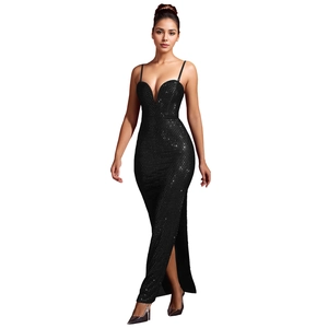 Detail showing shimmering black sequins and high side slit on slim evening dress