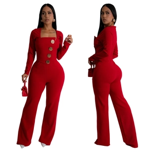 Close-up of red long sleeve jumpsuit with square neck and gold decorative buttons