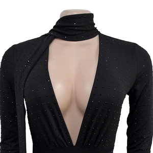 Close-up of deep V-neck black long sleeve bodysuit with sparkling rhinestones details