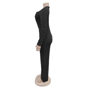 Side view detail of black long sleeve slimming jumpsuit on mannequin