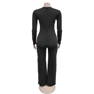 Detail view of black long sleeve jumpsuit featuring back invisible zipper and slim fit