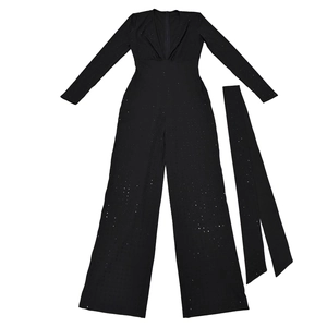 Close-up of black long sleeve V-neck jumpsuit with shimmering sequins and waist belt
