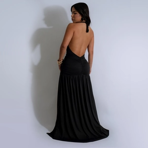 Detail of the open back design on a sexy black halter neck maxi dress with pleats