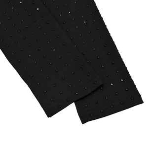 Detailed macro shot of black elastic fabric featuring rhythmic rows of shiny rhinestones