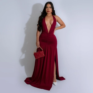 Detail of the elegant deep V-neckline and draped waist of this burgundy slit maxi dress