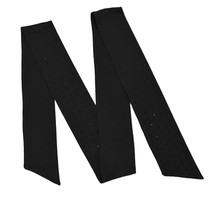 Detailed view of long black sash with sparkling rhinestones and slanted ends