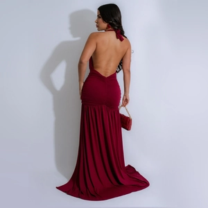 Detail of burgundy backless maxi dress with halter neck and ruched texture