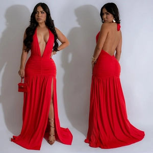 Detail view of red halter neck maxi dress with deep V-neck and high side split feature