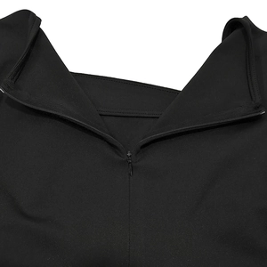 Close-up detail of a black invisible zipper on a long sleeve jumpsuit with clean stitching