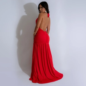 Detailed back view of a red backless evening dress with ruching and halter neckline