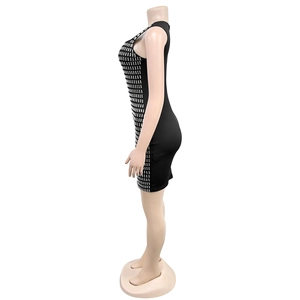 Detail of silver rhinestone embellishments on a black slim fit bodycon mini dress