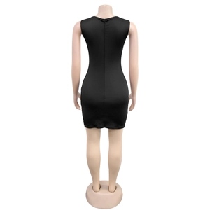 Detail view of the sleek black mini dress showing the invisible back zipper and slim fit