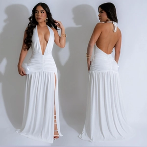 Detail view of white deep V-neck halter dress featuring waist pleats and a high slit cut