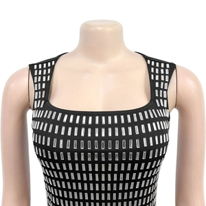 Detail of silver rectangular sequins on black bodycon dress with square neckline