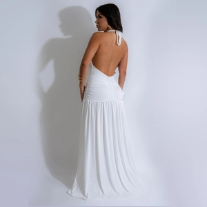 Detail of white halter neck maxi dress with ruched waist and pleated back texture