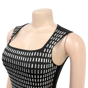Close-up of silver rhinestones and metallic studs on a black sleeveless bodycon dress