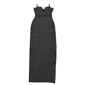 Detail of black rhinestone bodycon dress featuring slim straps and a deep V-neckline