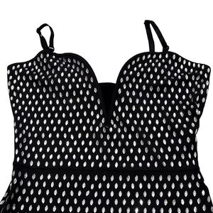 Close-up of silver marquise rhinestones on a black V-neck dress with adjustable straps