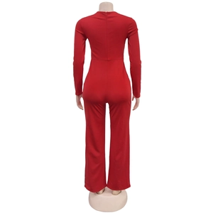 Back view of a red long sleeve slim jumpsuit showing the hidden zipper and wide leg design