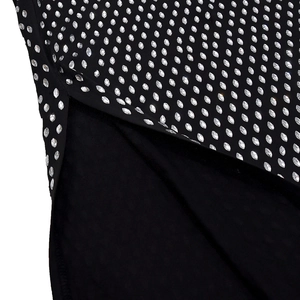 Detailed view of black bodycon dress featuring silver rhinestone grid and elegant side slit