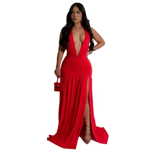 Detail of elegant red halter neck evening dress with ruched waist and high side split