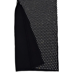 Detail view of black bodycon dress featuring dense silver rhinestone embellishments and side slit