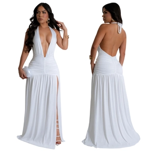 Macro detail of sexy white halter deep V-neck maxi dress with high slit and backless style