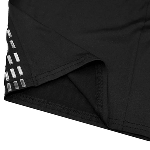 Macro shot of black knit dress hem with double row rectangular rhinestone embellishments