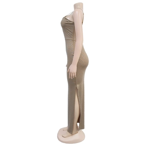 Detail of slim fit maxi dress with sparkling rhinestones and high side slit design