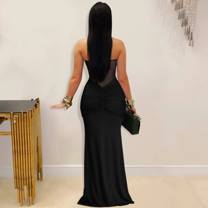 Detail view of black evening gown featuring sheer mesh back and ruched hip design