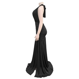 Elegant black halter backless evening gown with side ruching and a mermaid fisheye hemline