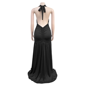 Close-up of the elegant backless design and ruched detail on this black halter evening dress