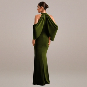 Detail of elegant dark green velvet evening gown with cape sleeves and open back design