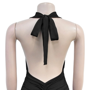 Detail of elegant black halter neck tie and open back design on a minimalist dress