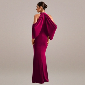 Detail view of the sleek back cut of this elegant fuchsia satin mermaid dress with cape sleeves