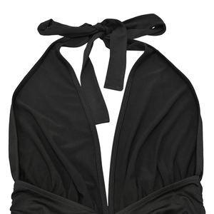 Detailed view of black halter dress with deep V-neck and adjustable bow-tie at the neck