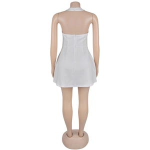 Detail view of the backless white halter dress with zipper closure on mannequin