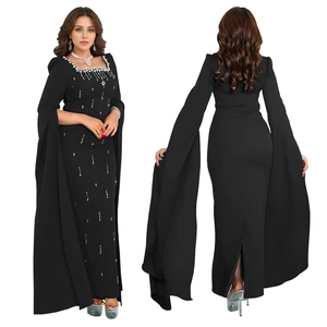 Front and back detail of elegant black dress with rhinestone neckline and cape sleeves