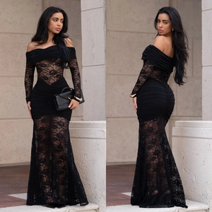 Detailed close-up of the elegant black lace off-shoulder fishtail dress and ruching details