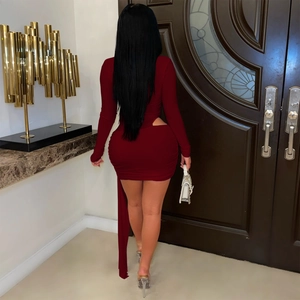Detail view of deep red slim fit dress featuring back cutout design and long decorative sash