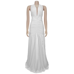 Close-up of white halter deep V-neck dress with elegant ruching and high side slit