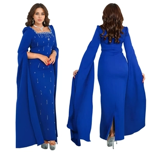 Detailed close-up of crystal embellishments on the neckline of a navy blue cape-sleeve dress