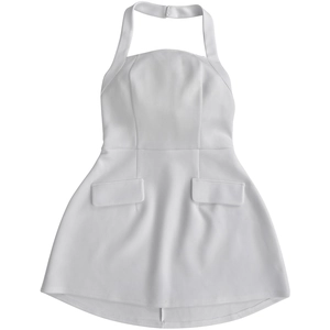 Close-up of white halter neck mini dress featuring decorative flap pockets and open back