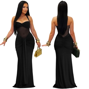 Detail showing sheer mesh panels and pleated side ruching on a black halter maxi dress