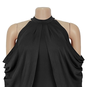 Detailed view of black off-shoulder halter neckline with elegant pleated fabric texture