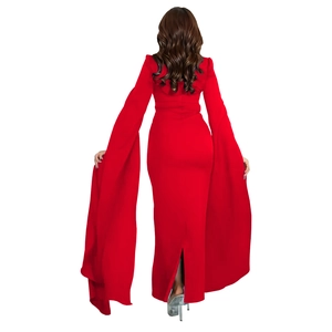 Detail of red slim dress with dramatic split cape sleeves and sparkling rhinestones